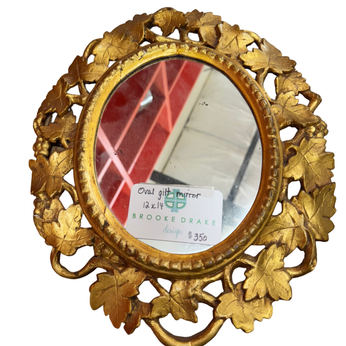 Gilt oval mirror