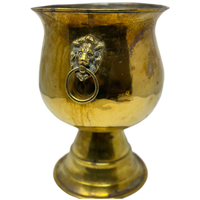 Brass lions head footed planter